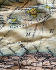 Close-up of a vintage map with text and geographical details.