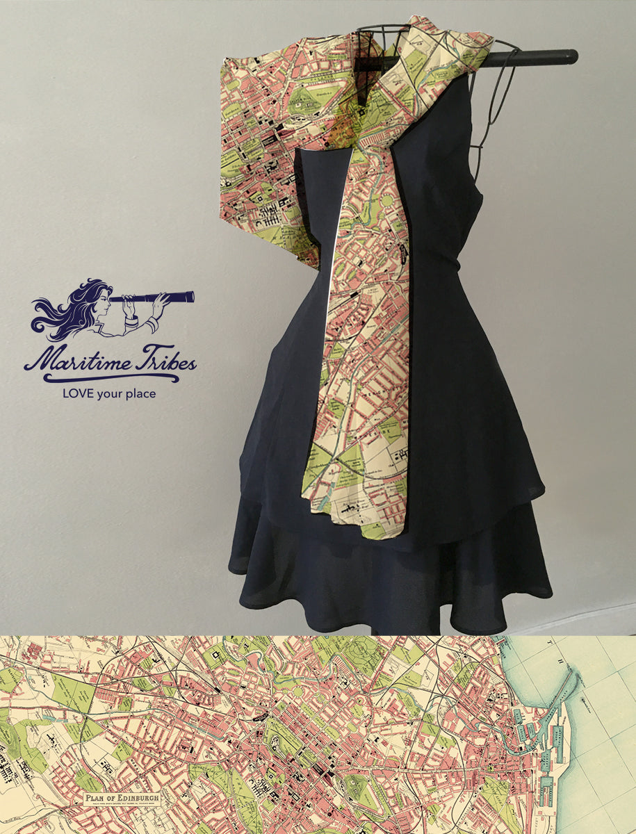 Black dress with a patterned scarf on a gray background, featuring the 'Maritime Tribes' brand.