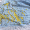 Map with yellow highlighted areas on a textured fabric background