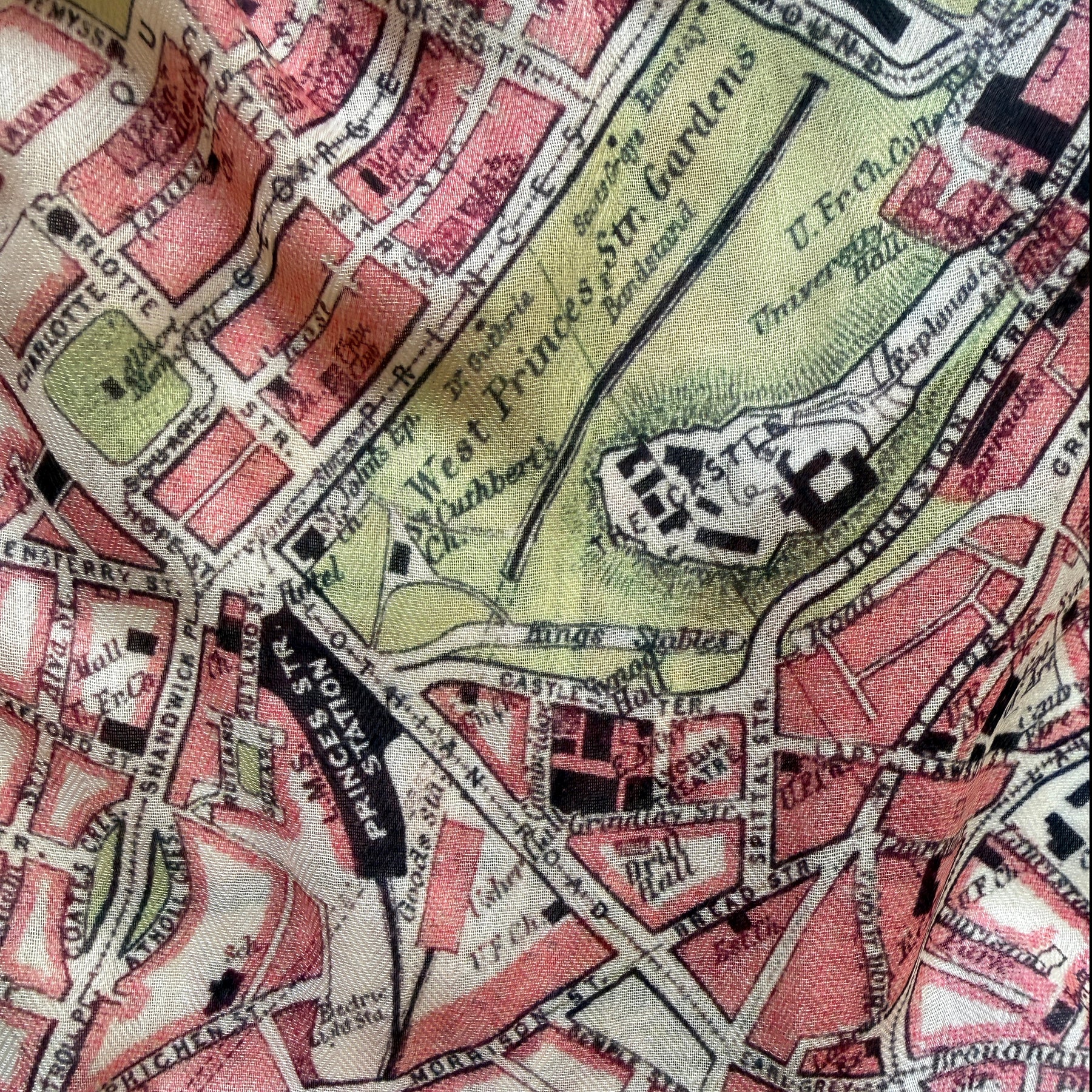 Vintage map detail showing streets and landmarks with a colorful layout.