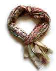 Map-themed scarf tied in a knot on a white background