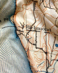 Topographic map with 'Richmond' labeled on a textured fabric background