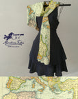 Black dress with a map-patterned scarf draped over a gray background, featuring the 'Maritime Tribes' brand.