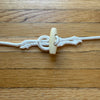 A Spacer for the Flags: Cordage, loop and toggle